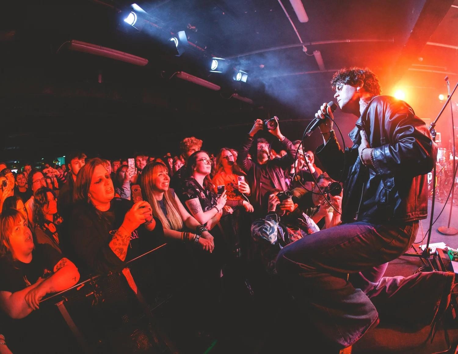 A crowd at a local live music show